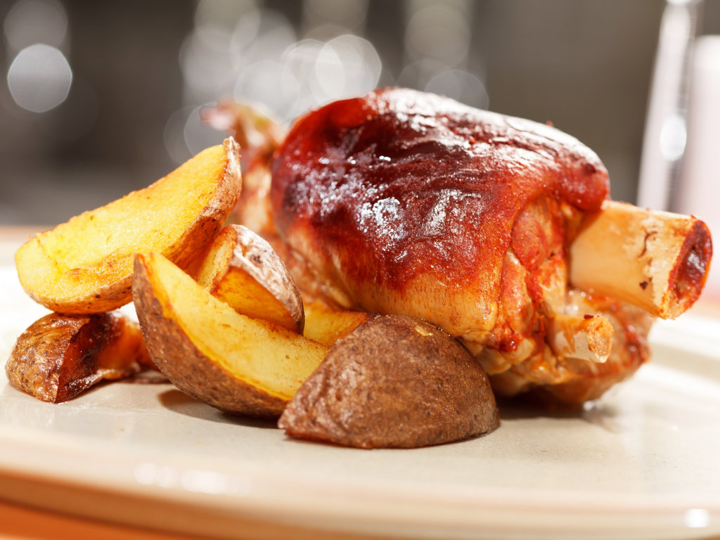 roasted pork knuckle with potatoes